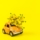 close-up-yellow-flower-toy-car-against-yellow-background (1)